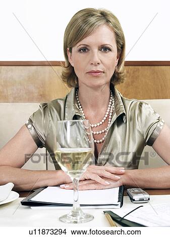 Picture - Businesswoman in restaurant, portrait. Fotosearch