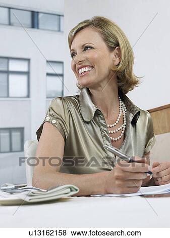 Stock Photo - Businesswoman working in restaurant. Fotosearch