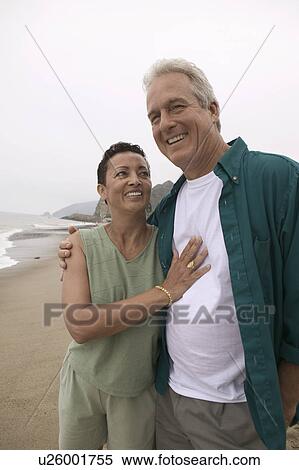 Couple embracing on beach View Large Photo Image Stock Photography - Couple embracing on beach. Fotosearch
