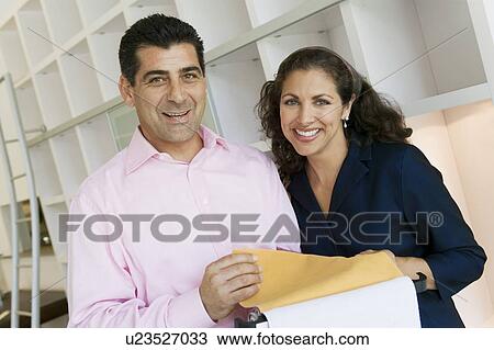 Couple Examining Fabric Swatches in furniture store, portrait View Large Photo Image Stock Image - Couple Examining Fabric Swatches in furniture store, portrait. Fotosearch