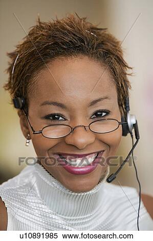 Stock Photography - Customer Service Representative With Headset, portrait. Fotosearch