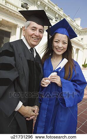 Dean and graduate outside university, portrait View Large Photo Image Stock Photograph - Dean and graduate outside university, portrait. Fotosearch