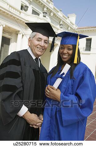 Dean and graduate outside university, portrait View Large Photo Image Stock Photography - Dean and graduate outside university, portrait. Fotosearch