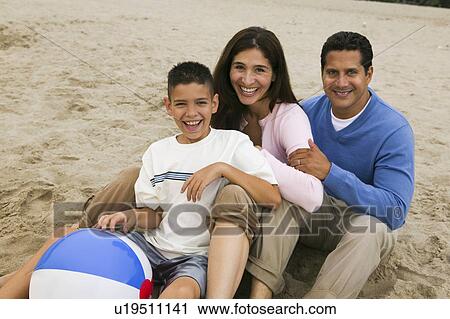 Stock Image - Family on Beach. Fotosearch