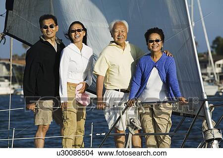 Picture - Family on sailboat, (portrait). Fotosearch