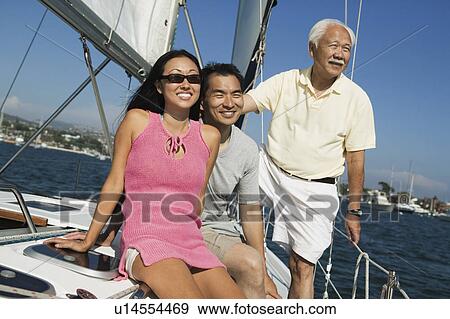 Family on sailboat View Large Photo Image Stock Photo - Family on sailboat. Fotosearch