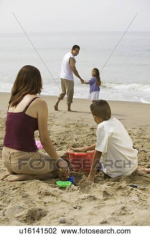 Family Playing on the Beach View Large Photo Image Stock Image - Family Playing on the Beach. Fotosearch