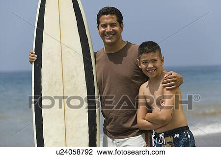 Stock Image - Father and Son at the Beach. Fotosearch