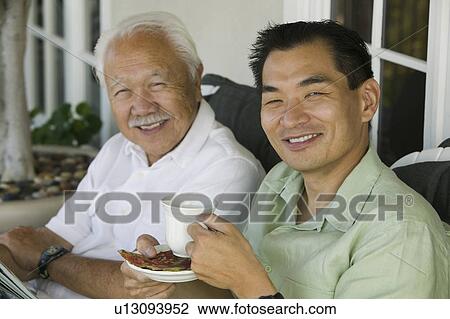 Father and son drinking coffee, outdoors, (portrait) View Large Photo Image Stock Image - Father and son drinking coffee, outdoors, (portrait). Fotosearch