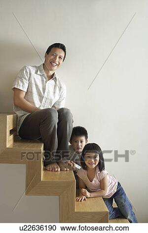 Father Sitting with Children on wooden Staircase View Large Photo Image Stock Image - Father Sitting with Children on wooden Staircase. Fotosearch