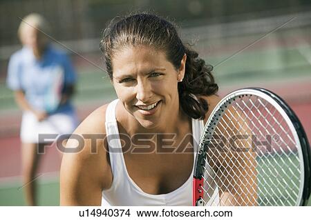 Female Doubles Tennis Players Waiting For Serve Focus On Foreground Close Up Picture U Fotosearch