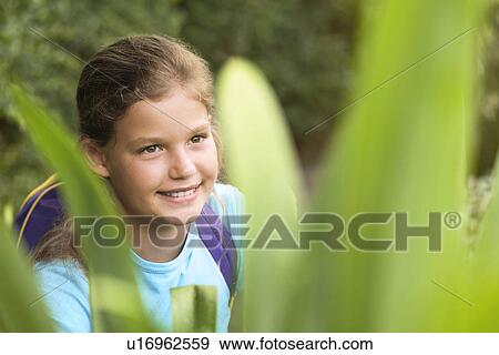 Girl Looking at Plants View Large Photo Image Stock Photo - Girl Looking at Plants. Fotosearch