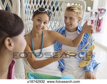 Girl Showing Off New Shoes to friends in clothing store View Large Photo Image Stock Image - Girl Showing Off New Shoes to friends in clothing store. Fotosearch