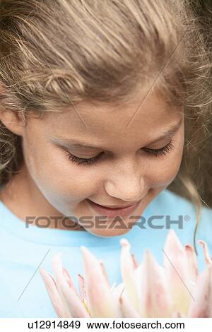 Girl Smelling Flower View Large Photo Image Stock Photo - Girl Smelling Flower. Fotosearch