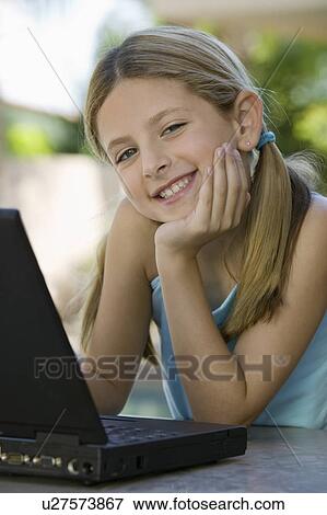 Girl Using Laptop on Patio View Large Photo Image Stock Photo - Girl Using Laptop on Patio. Fotosearch