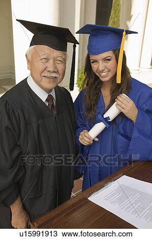 Graduate and dean at podium outside, portrait View Large Photo Image Stock Image - Graduate and dean at podium outside, portrait. Fotosearch
