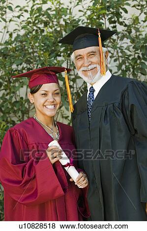 Graduate and dean outside, portrait View Large Photo Image Stock Photo - Graduate and dean outside, portrait. Fotosearch