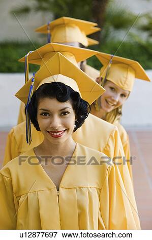 Stock Photo - Graduates in line for degree outside, elevated view. Fotosearch