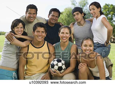 Group of people in park with woman holding soccer ball. View Large Photo Image Stock Image - Group of people in park with woman holding soccer ball.. Fotosearch
