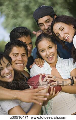 Group of young people playing football. View Large Photo Image Stock Image - Group of young people playing football.. Fotosearch