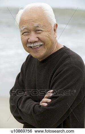 Mature man smiling, outdoors, (portrait) View Large Photo Image Stock Photograph - Mature man smiling, outdoors, (portrait). Fotosearch