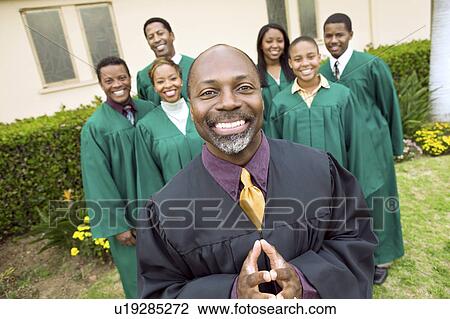Minister in church garden, gospel choir in background, portrait View Large Photo Image Stock Image - Minister in church garden, gospel choir in background, portrait. Fotosearch