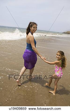 Stock Photo - Mother and Daughter at Beach. Fotosearch
