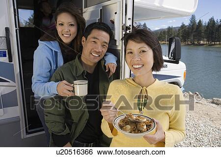 Parents and teenage daughter eating breakfast in RV at lake View Large Photo Image Stock Photograph - Parents and teenage daughter eating breakfast in RV at lake. Fotosearch