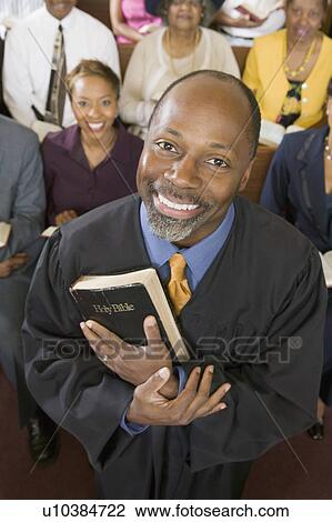 Stock Image - Preacher and Congregation, portrait, high angle view. Fotosearch