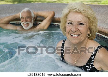 Stock Photo - Senior Couple in Hot Tub, portrait.. Fotosearch