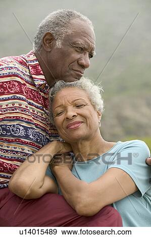 Stock Photo - Senior couple relaxing outdoors. Fotosearch