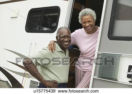 Senior couple with motor home, (portrait) View Large Photo Image Stock Photo - Senior couple with motor home, (portrait). Fotosearch