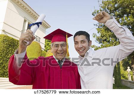 Senior Graduate hoisting diploma with son outside, portrait View Large Photo Image Stock Photo - Senior Graduate hoisting diploma with son outside, portrait. Fotosearch