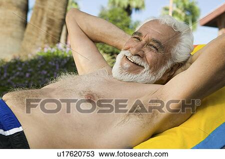 Senior Man Lying on sunlounger, portrait. View Large Photo Image Stock Image - Senior Man Lying on sunlounger, portrait.. Fotosearch