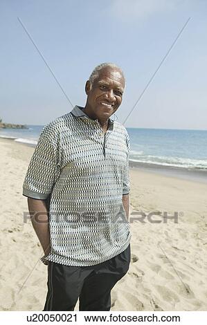 Senior man on beach, (portrait) View Large Photo Image Stock Image - Senior man on beach, (portrait). Fotosearch