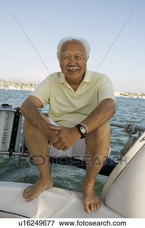 Senior man on sailboat, (portrait) View Large Photo Image Stock Photo - Senior man on sailboat, (portrait). Fotosearch