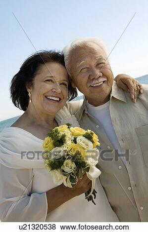 Stock Photo - Senior Newly wed couple, outdoors, (portrait). Fotosearch