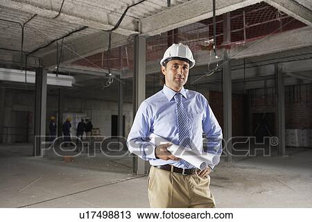 Stock Image - Site manager on construction site. Fotosearch
