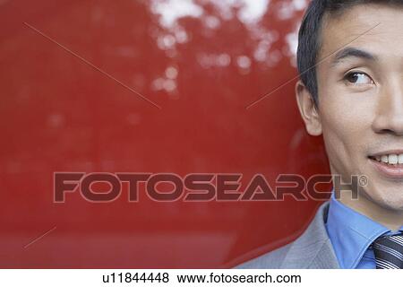 Stock Photo - Smiling, Young Businessman, close-up, cropped. Fotosearch