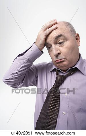 Stressed Businessman, head in hand View Large Photo Image Stock Image - Stressed Businessman, head in hand. Fotosearch