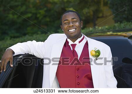 Teenage Boy in suit leaning on limo, portrait View Large Photo Image Stock Image - Teenage Boy in suit leaning on limo, portrait. Fotosearch