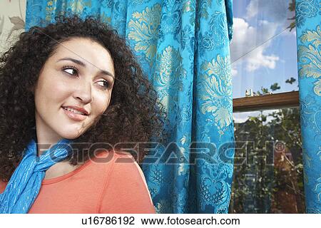 Teenage Girl in scarf, looking over shoulder out window View Large Photo Image Stock Image - Teenage Girl in scarf, looking over shoulder out window. Fotosearch