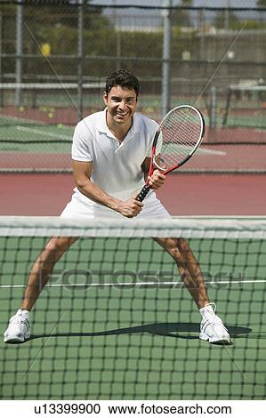 Stock Image - Tennis Player on court Ready to Play, front view. Fotosearch