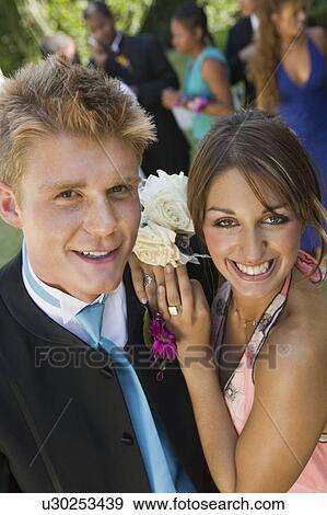 Well-dressed teenage couple standing outside school dance, elevated view View Large Photo Image Stock Photo - Well-dressed teenage couple standing outside school dance, elevated view. Fotosearch