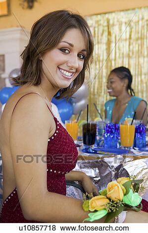 Stock Photo - Well-dressed teenager girl at school dance. Fotosearch