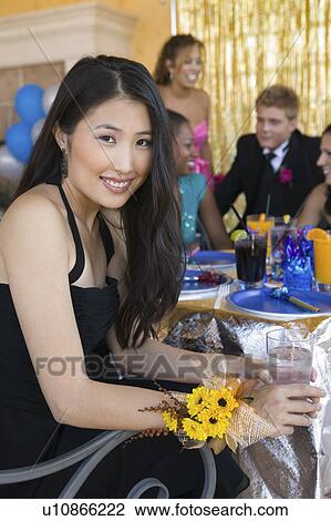 Well-dressed teenager girl sitting at school dance View Large Photo Image Stock Image - Well-dressed teenager girl sitting at school dance. Fotosearch