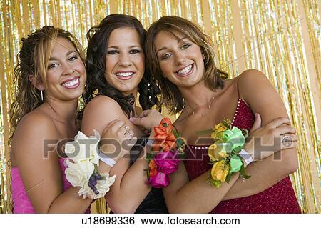 Stock Photograph - Well-dressed teenager girls at school dance, portrait. Fotosearch