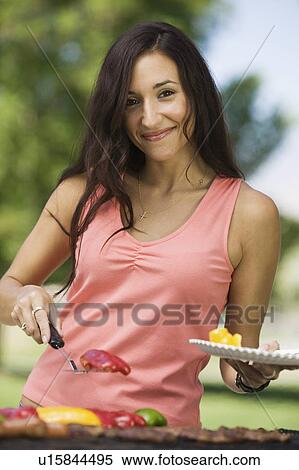 Woman Grilling Food at Park, portrait. View Large Photo Image Stock Photography - Woman Grilling Food at Park, portrait.. Fotosearch