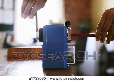 Woman using manual pencil sharpener, close-up. View Large Photo Image Picture - Woman using manual pencil sharpener, close-up.. Fotosearch