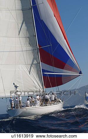 Stock Photo - Yacht on ocean with full sail. Fotosearch